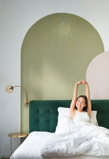 beautiful-korean-girl-stretching-hands-lying-bed-mornings-bedroom-with-luxurious-hotel-interio